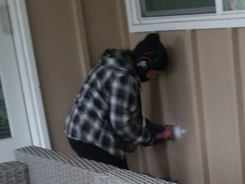 Professional electrician installing an exterior outlet in Summit