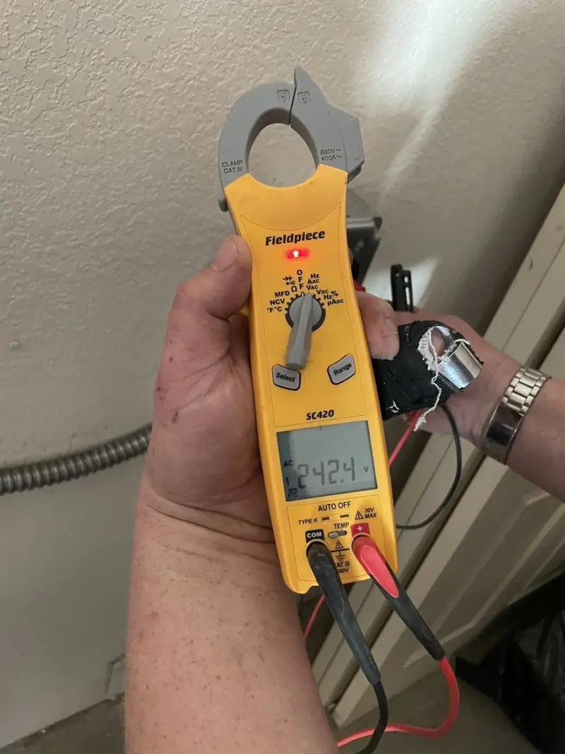 Voltage testing with clamp meter during Aluminum Wiring Replacement in Summit
